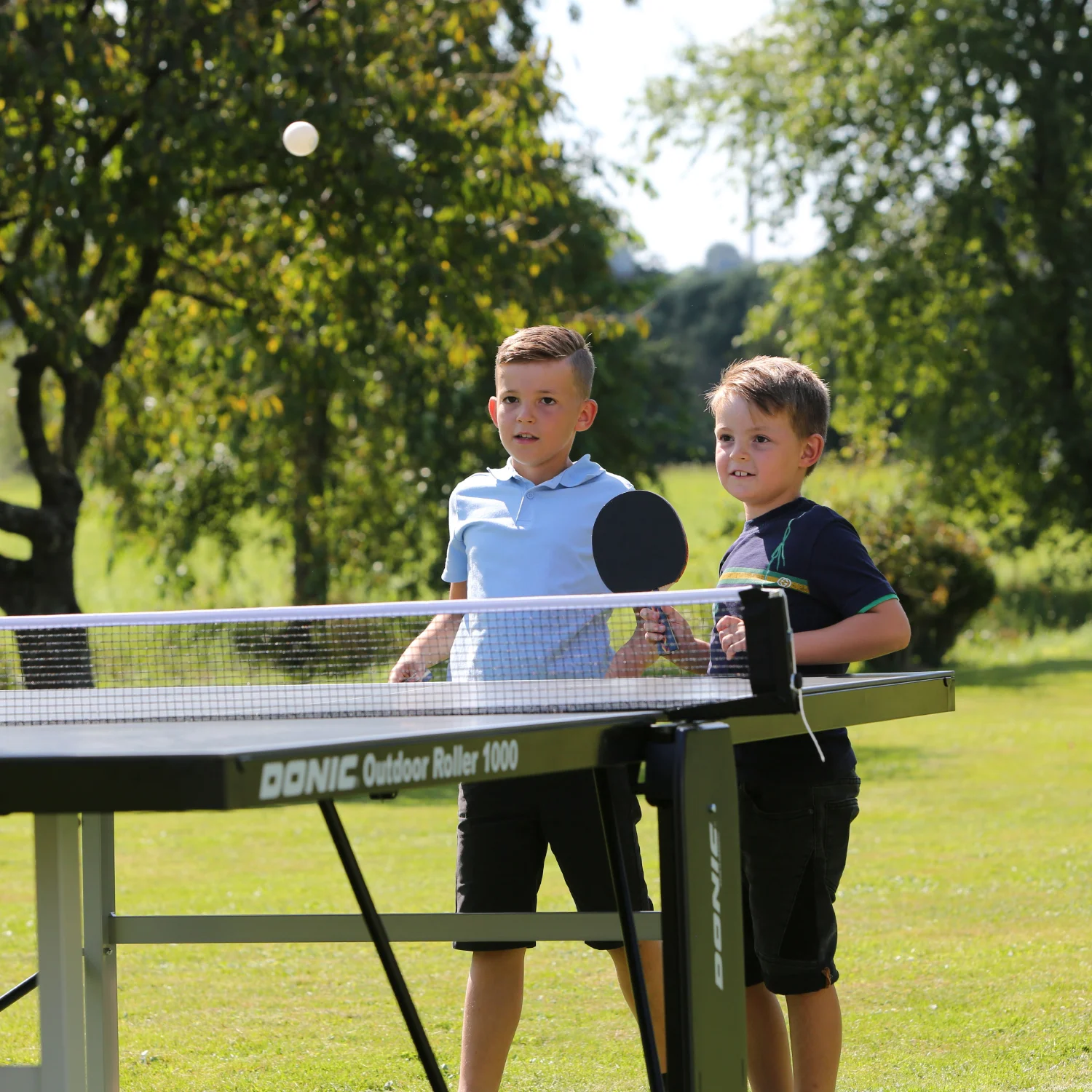 Реальное фото Теннисный стол DONIC OUTDOOR ROLLER 1000 BLUE 230291-B от магазина Спортев