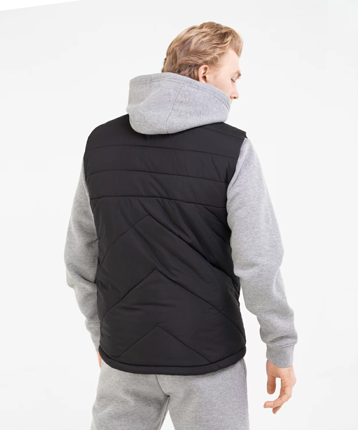 Реальное фото Жилет утепленный ESSENTIAL Padded Vest, черный Jögel от магазина Спортев