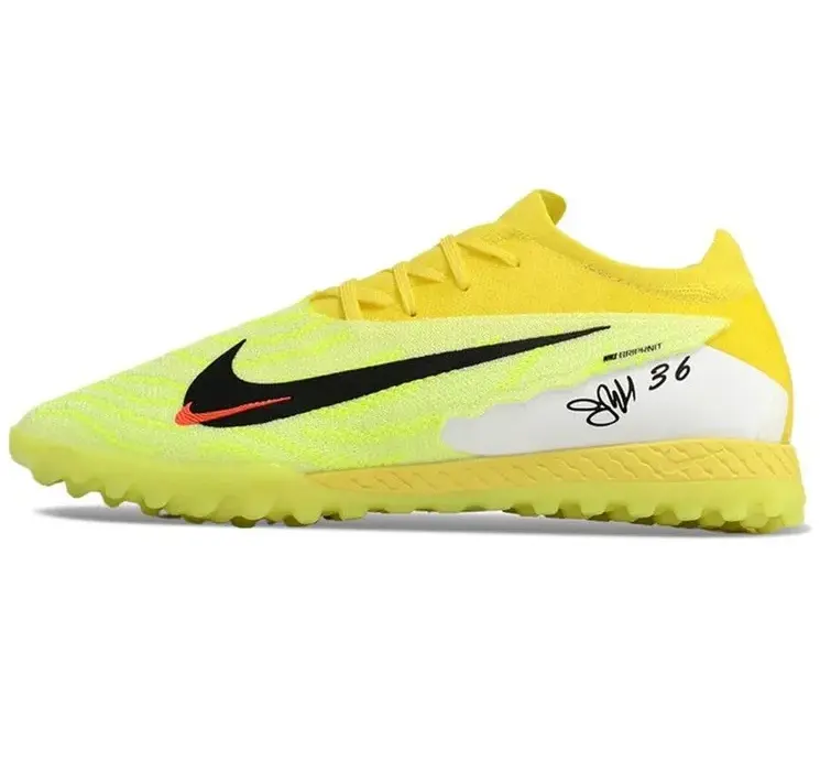 Реальное фото Бутсы Nike Phantom GX Elite turf зеленый/лимон от магазина Спортев