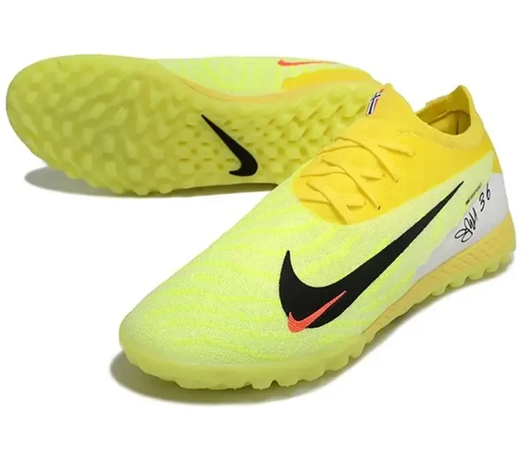 Реальное фото Бутсы Nike Phantom GX Elite turf зеленый/лимон от магазина Спортев
