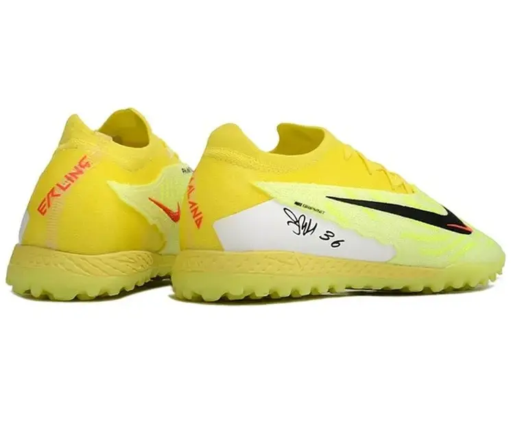 Реальное фото Бутсы Nike Phantom GX Elite turf зеленый/лимон от магазина Спортев