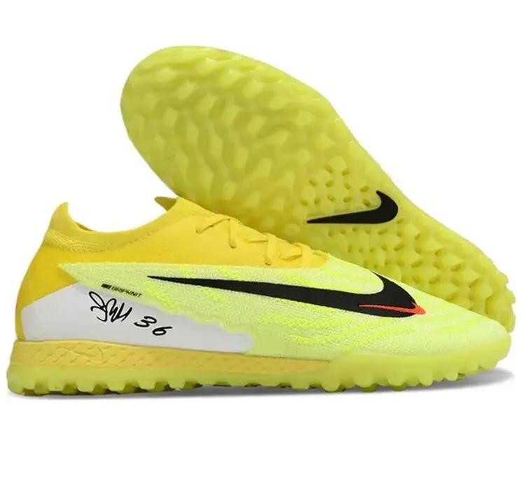 Реальное фото Бутсы Nike Phantom GX Elite turf зеленый/лимон от магазина Спортев