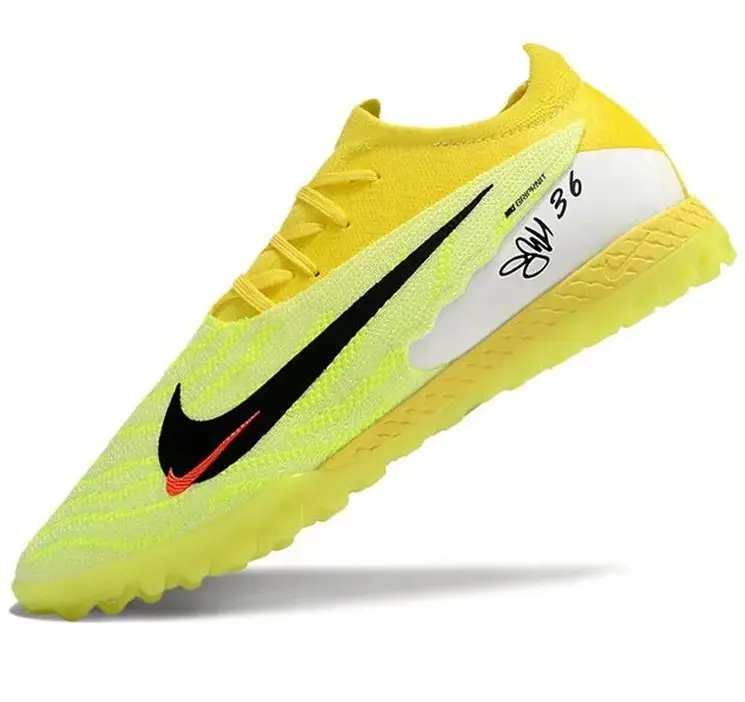 Реальное фото Бутсы Nike Phantom GX Elite turf зеленый/лимон от магазина Спортев